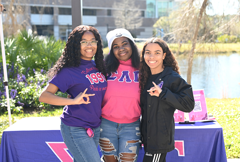 sorority students posing with their letters