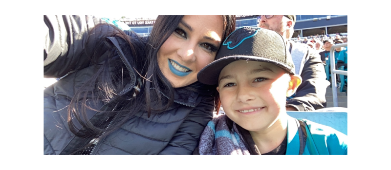 Photo of Haley Adams at a Jaguars game with her son.