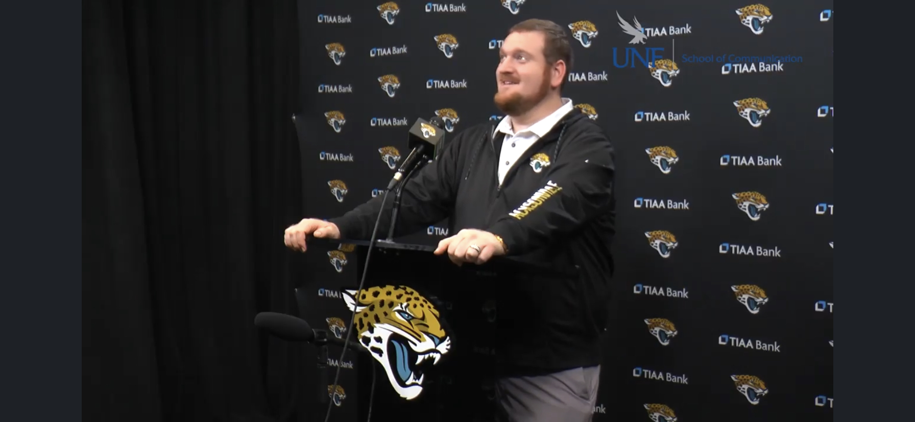 Max Hochman at the microphone at Jaguars event.