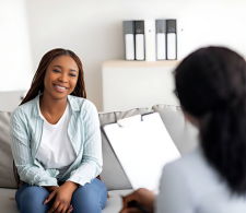 A woman smiling in a therapy session