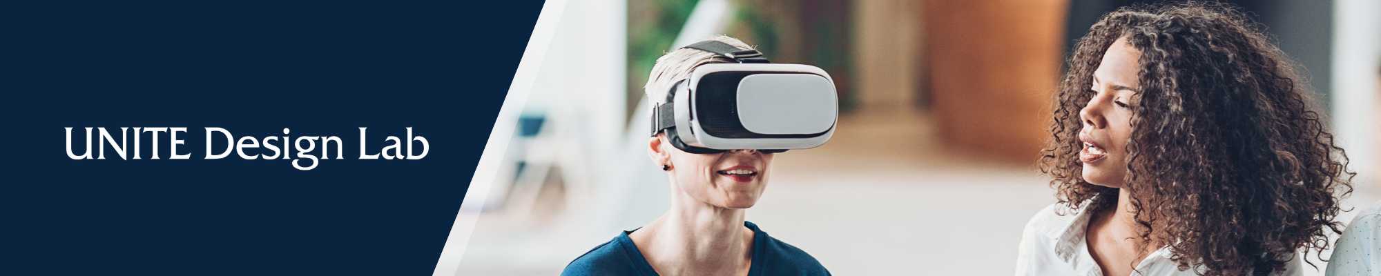 UDL Banner with two women using Virtual Reality goggles
