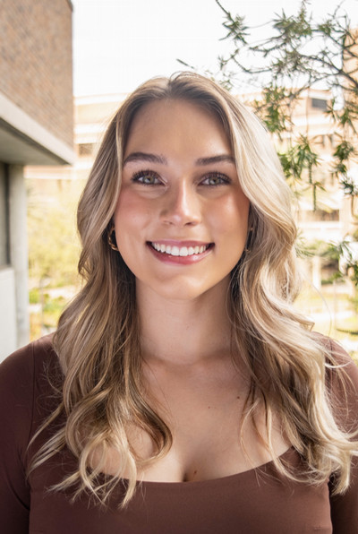 Headshot of Ansley Nicolaus outside Coggin College building