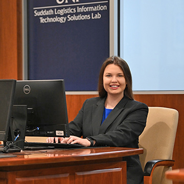 Alexandria Crotts sitting at a desk in front of a computer