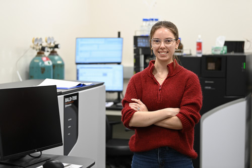 UNF spring 2024 graduate Molly Dubrow posing in a lab