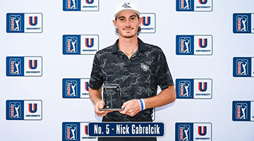Nick Gabrelcik posing with PGA award