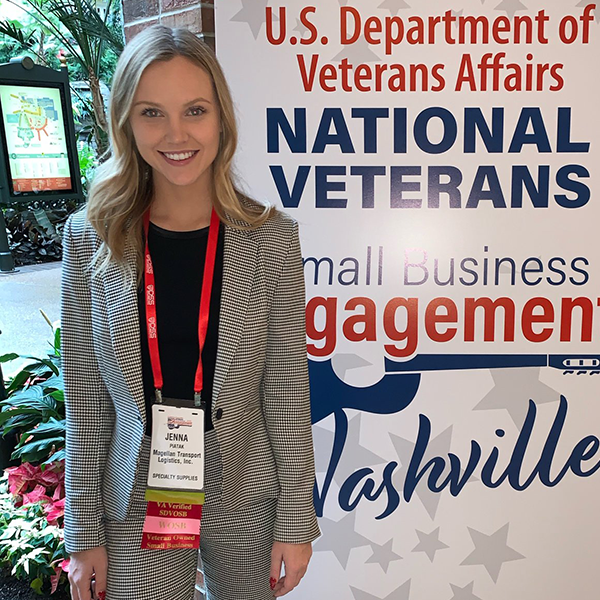 jenna in front national veterans small business conference banner