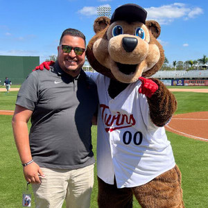 victor posing with Twins bear mascot