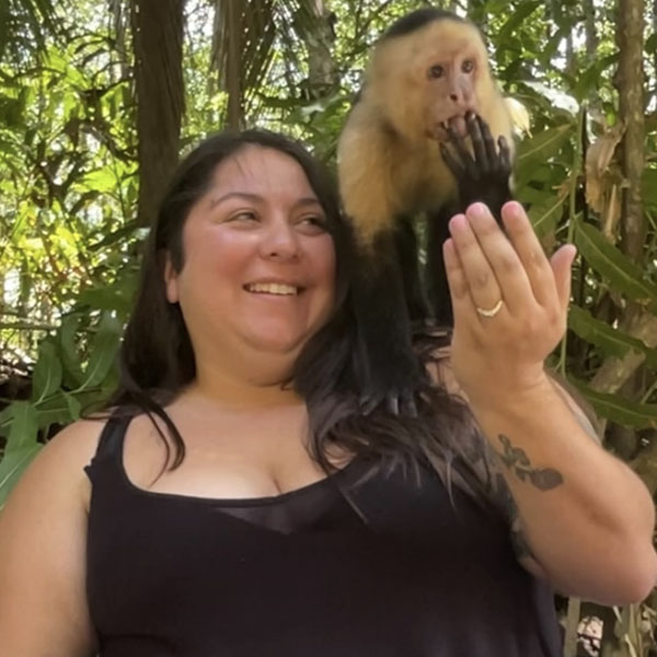 brittany feeding a monkey